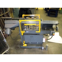 Safety guard installed on a horizontal band saw.