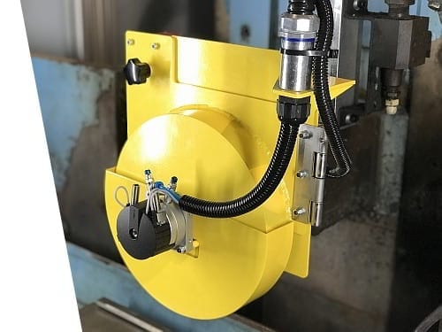Automated safety cover for a grinding wheel with pneumatic actuation designed by Ferndale Safety.