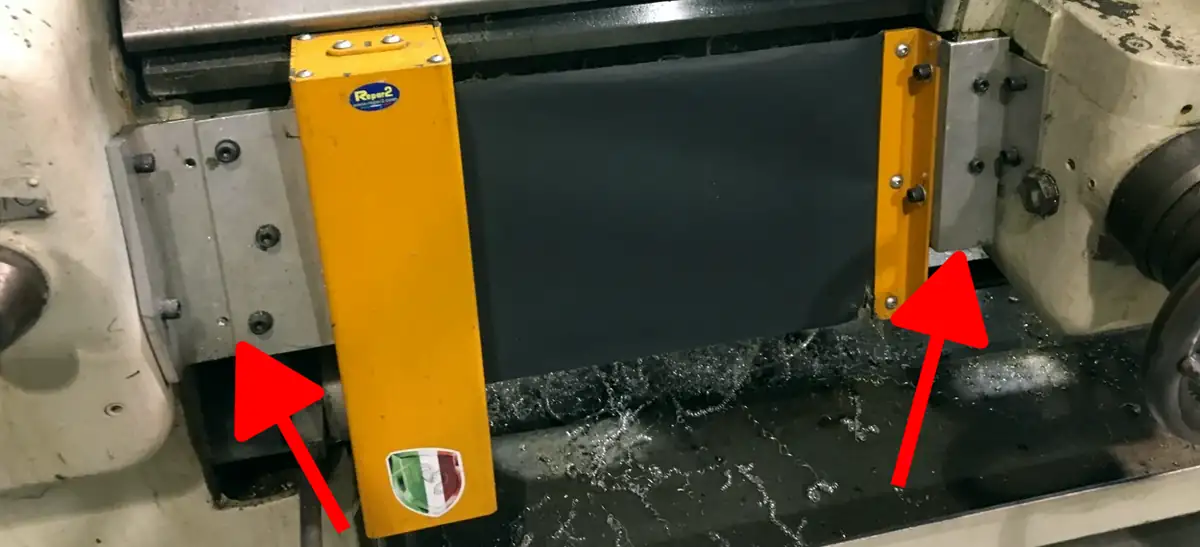 An example of a flat installation point for a lathe chuck safety shield. An arrow points to the mounting bracket.