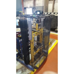 A hydraulic press with a steel mesh safety curtain installed for protection against ejections.