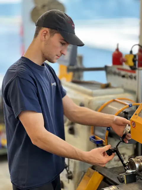 Ferndale Safety worker adjusting a lathe