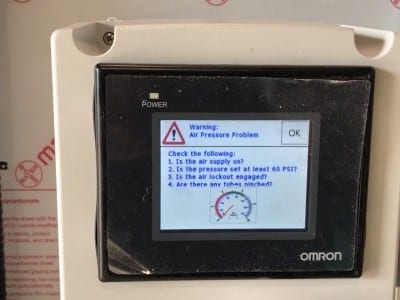 HMI panel on an automated surface grinder safety system.