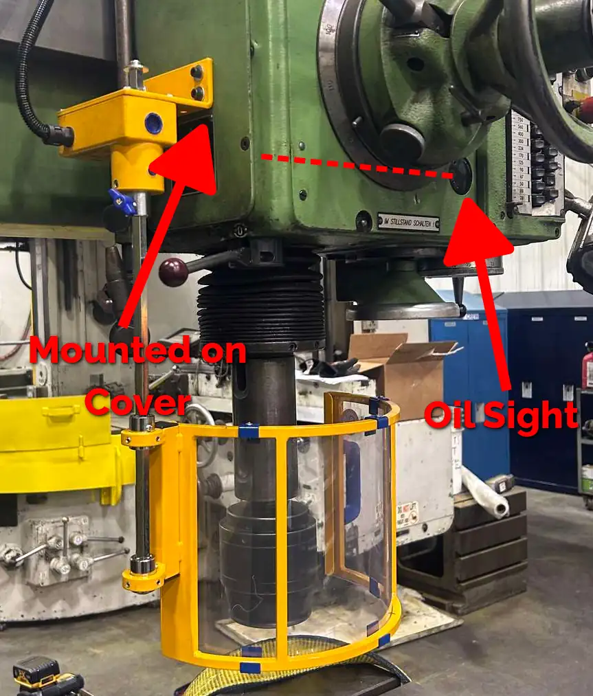 An example of a flat installation point for a lathe chuck safety shield. An arrow points to the mounting bracket.