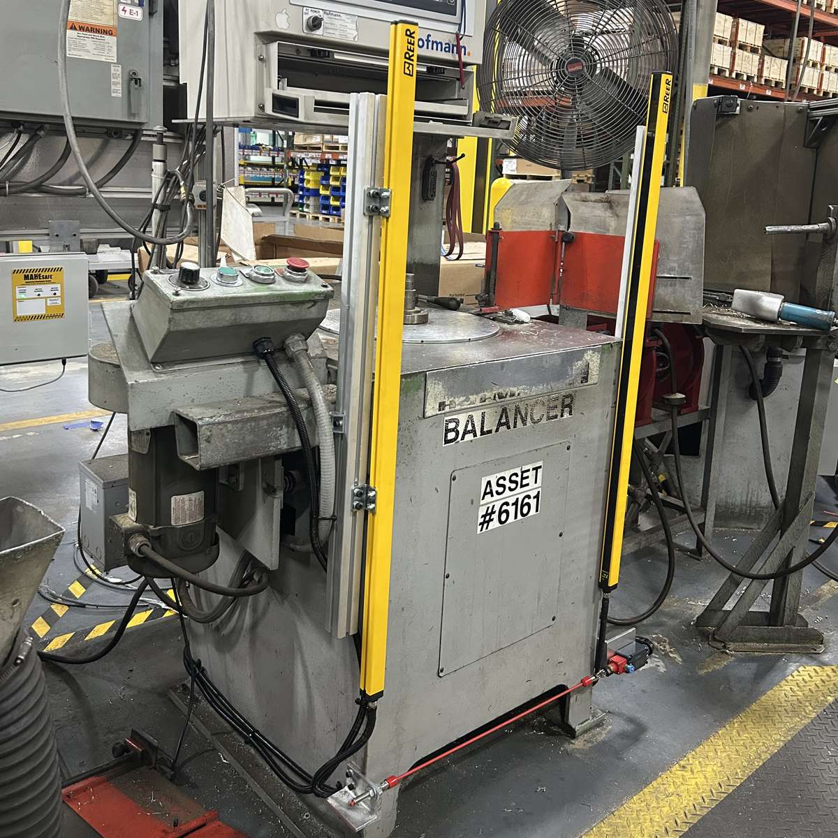 A pair of safety light curtains installed on an industrial machine.