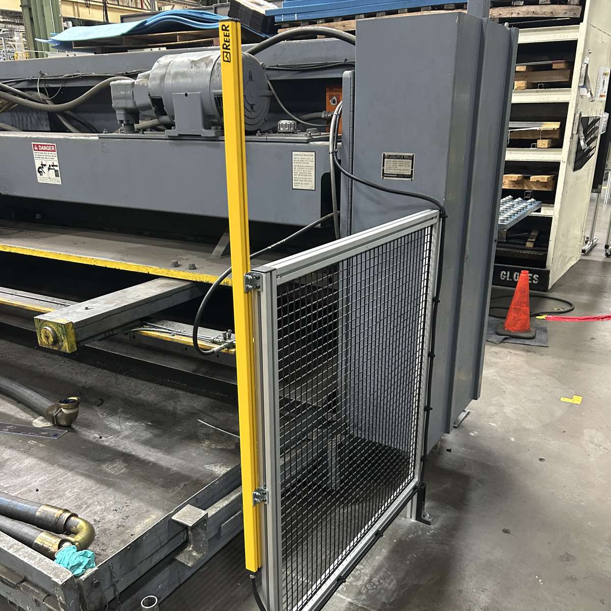 A pair of safety light curtains installed on an industrial machine.