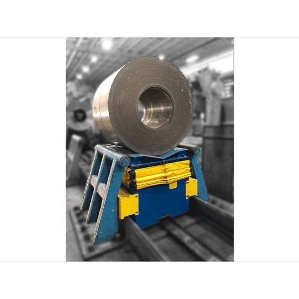 A large roll of sheet steel being lifted with a fully safeguarded lift table.
